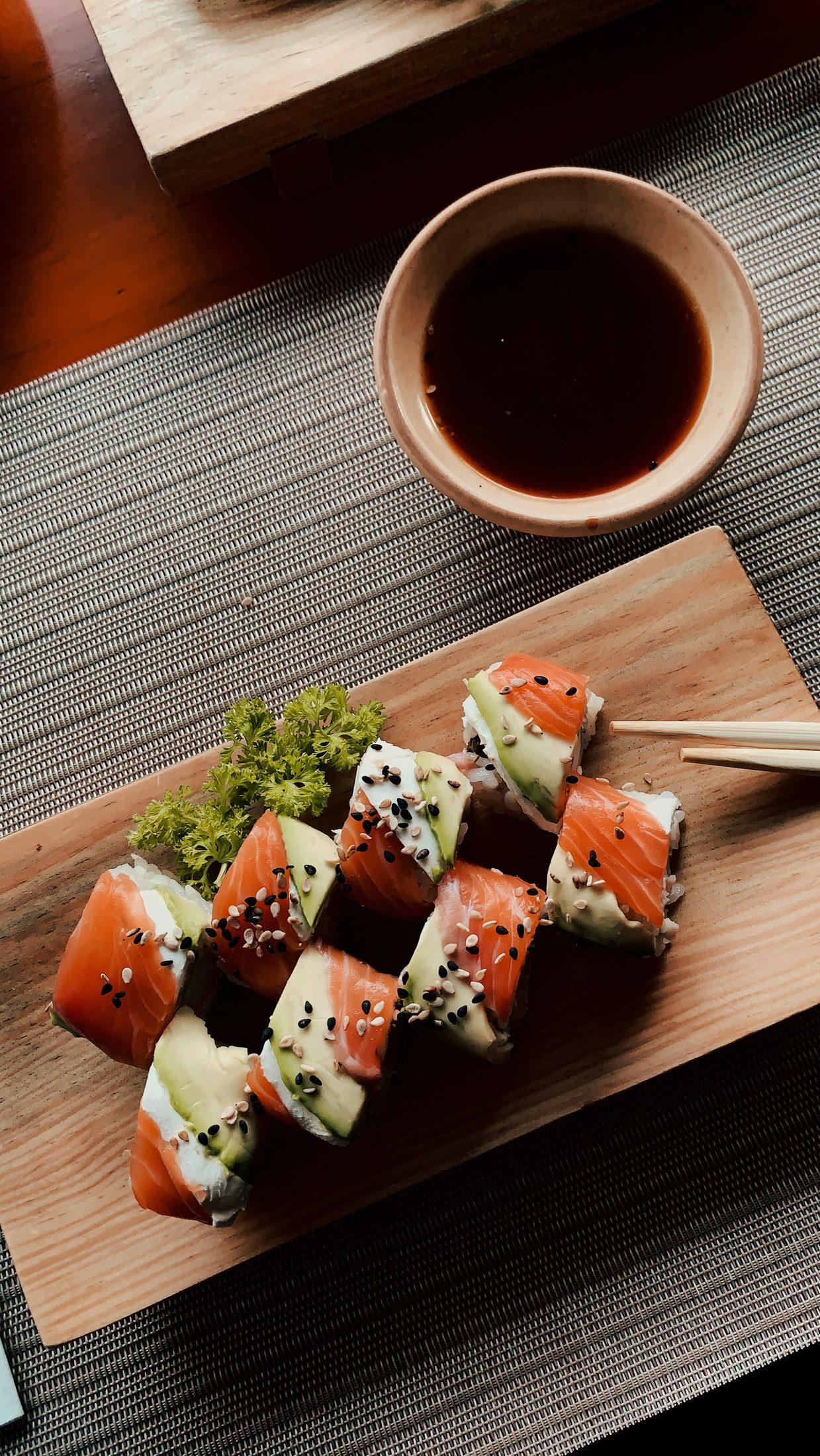 Sushi arranged on a wooden board